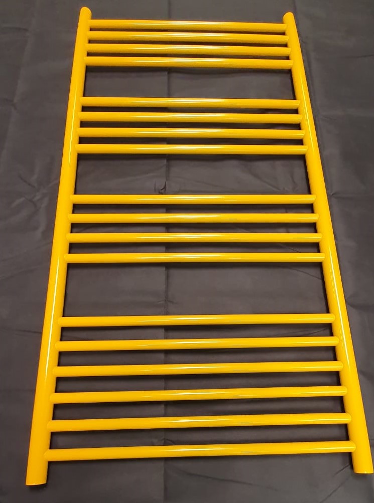 Close up image of a painted yellow radiator