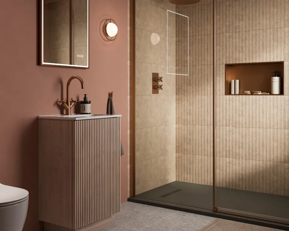 image of a bathroom with a fluted vanity unit in a dark beige bathroom with walk in shower enclosure and bronze fixtures and fittings