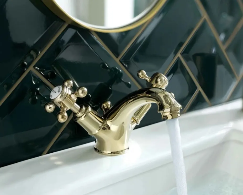 image of a polished gold mono basin tap with traditional crosshead handle design