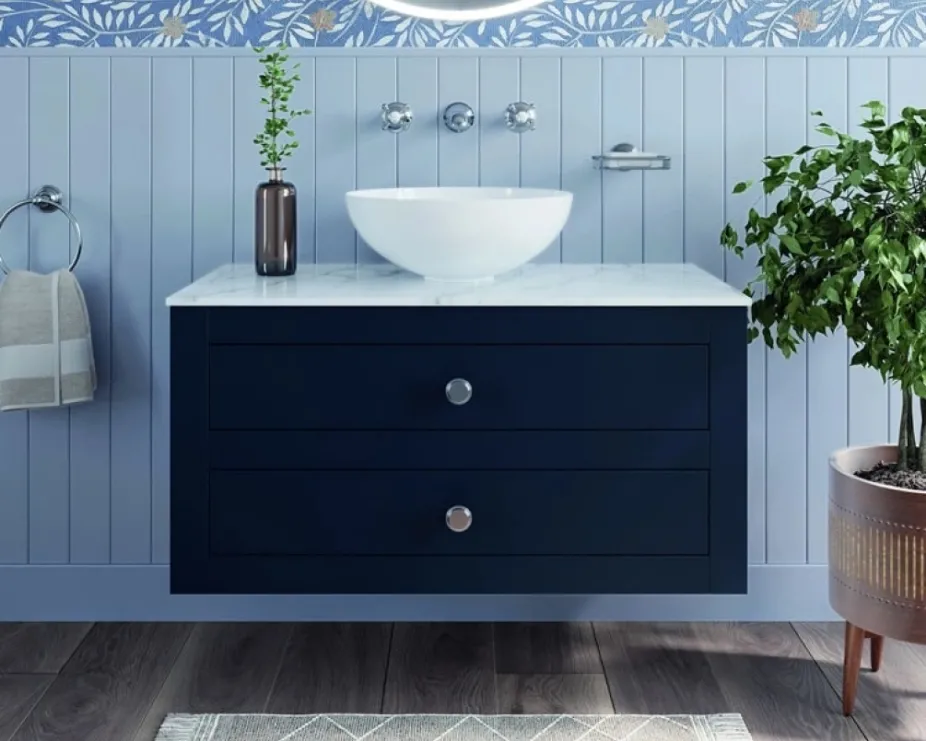 image of a blue vanity unit with blue floral patterned wall and lilac wood panels highlighting colour drenching trend