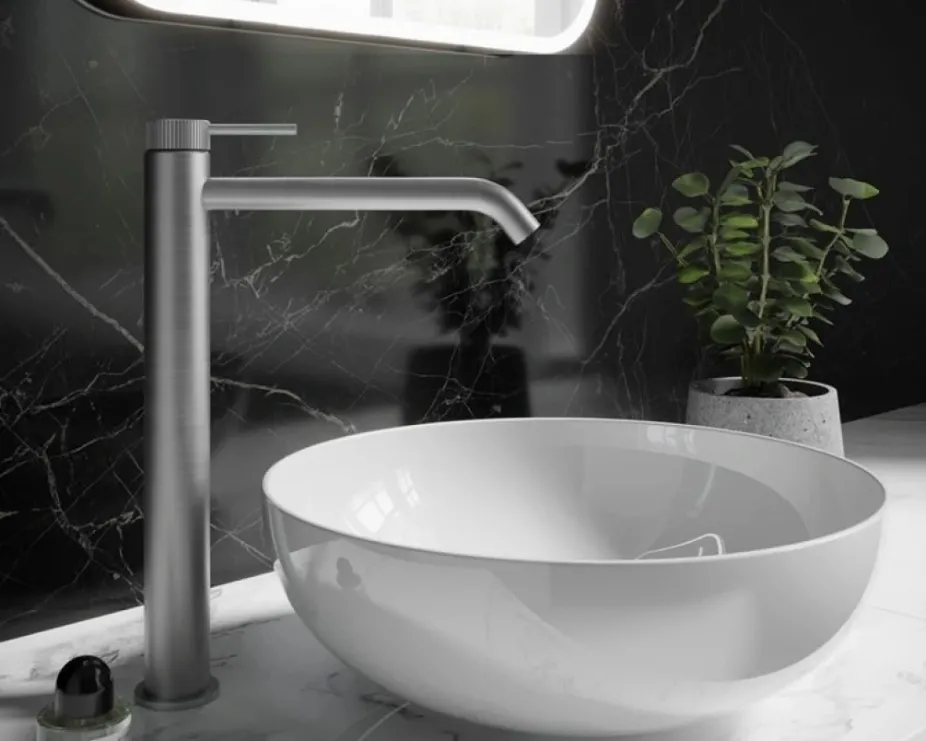 image of crosswater brushed stainless steel 3one6 tap next to countertop basin and black marble wall