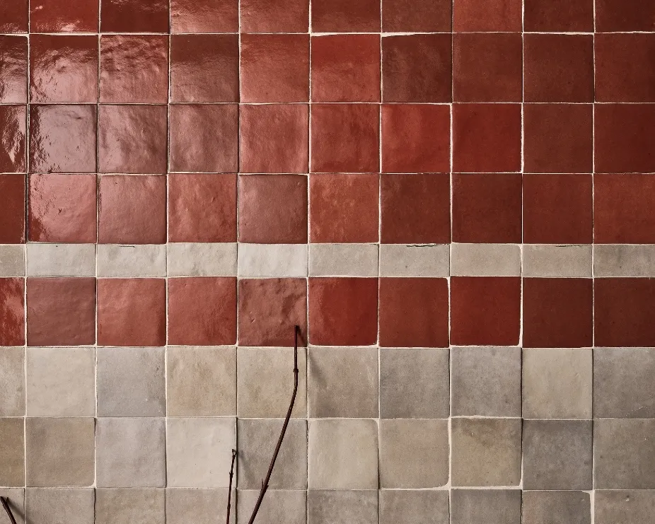 image of a red and white mosaic squared tiled wall using zellige inspired handmade tiles