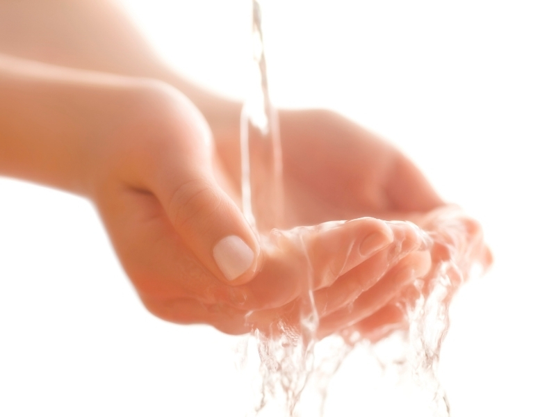 running hand under hot water