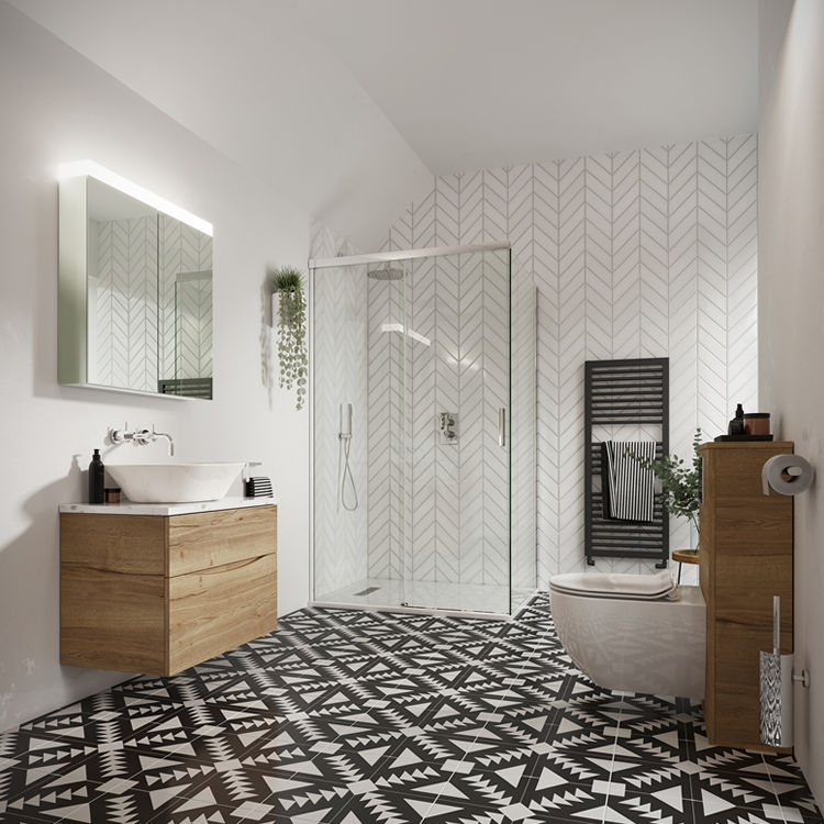 Lifestyle image of a monochrome themed bathroom, featuring black and white floor tiles, white chevron style wall tiles, matt black raditator and chrome plated brassware