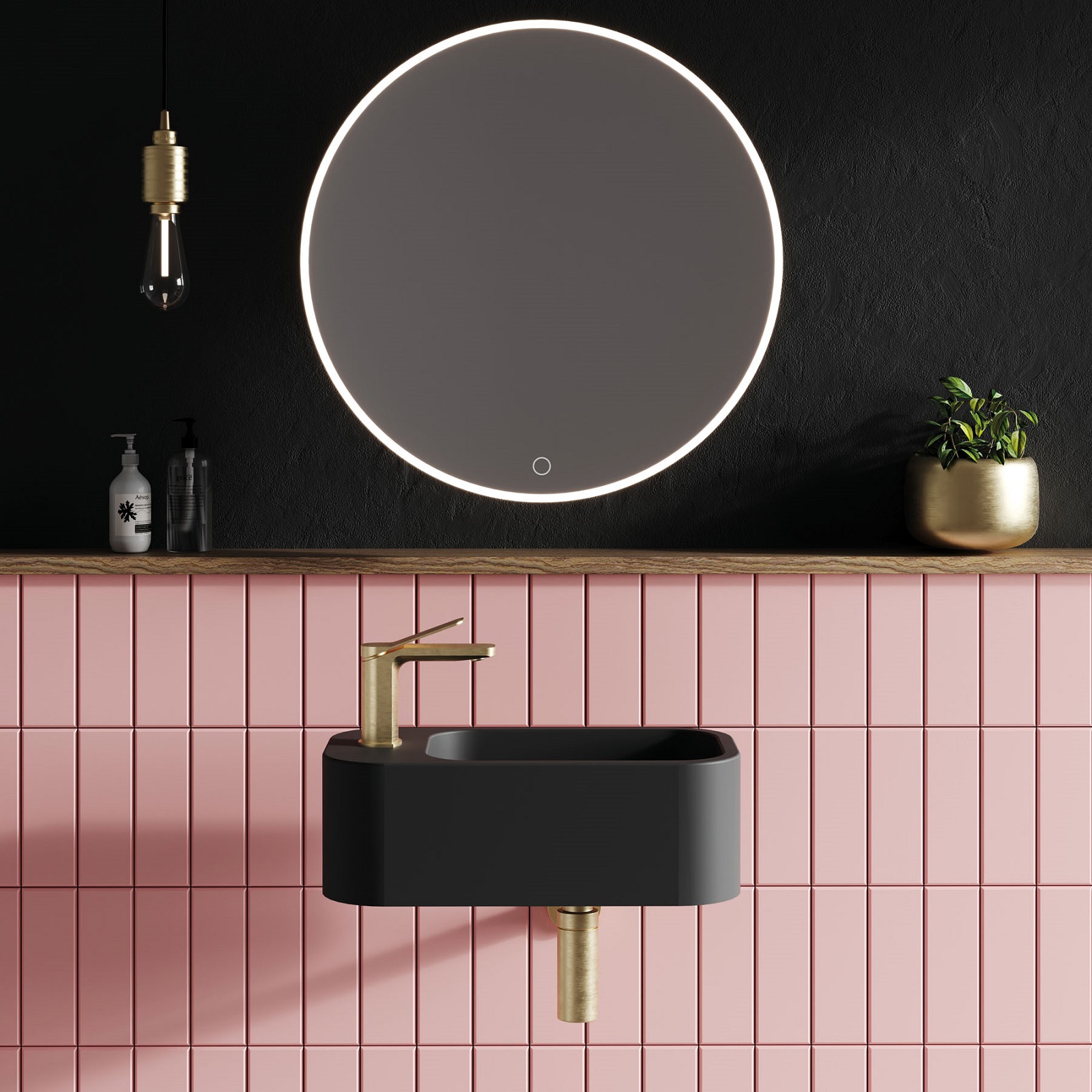 Lifestyle image of a bathroom with painted black walls and a matt black wall hung basin contrast against pink tiles