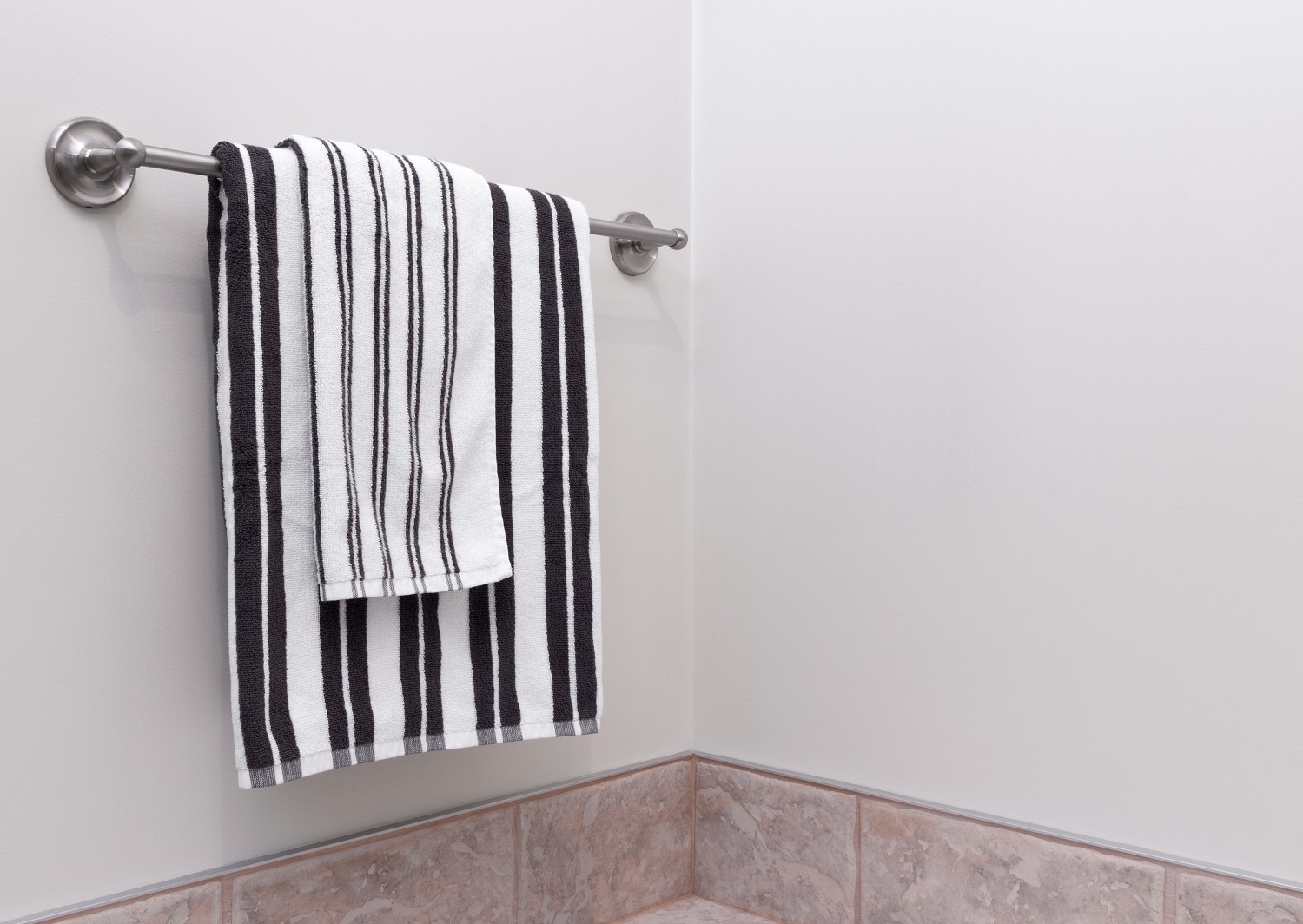 Close up image of black and white striped bath towels