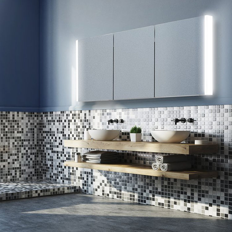 Product Lifestyle image of the HIB Paragon 1200mm LED Aluminium Cabinet installed above mosaic tiled walls and a wall mounted wooden countertop