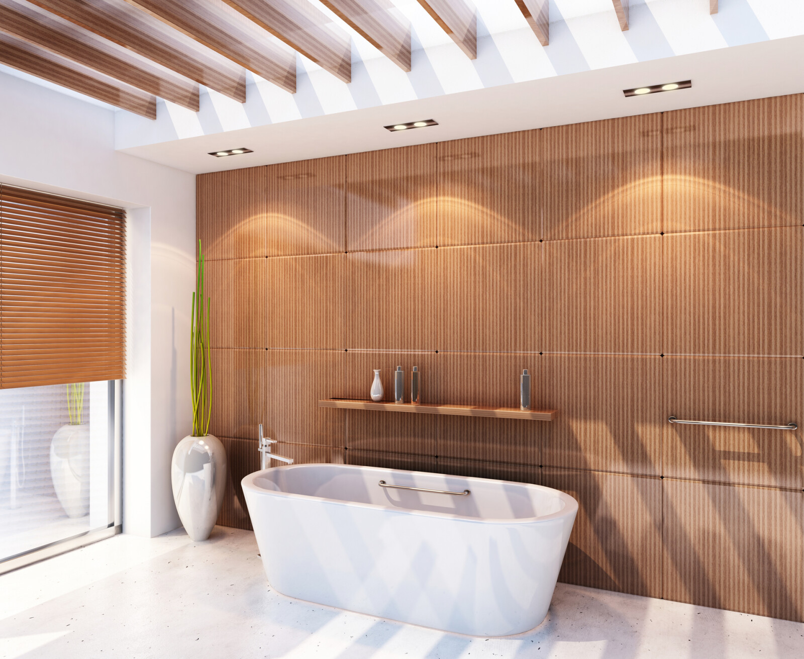 Digital lifestyle image of a Scandi inspired Hotel style bathroom, featuring a white stone floor, wood panelled walls with integrated shelving, a freestanding bath with floorstanding bathtap and handset shower attachment, wooden slotted blinds and a large potted succulent