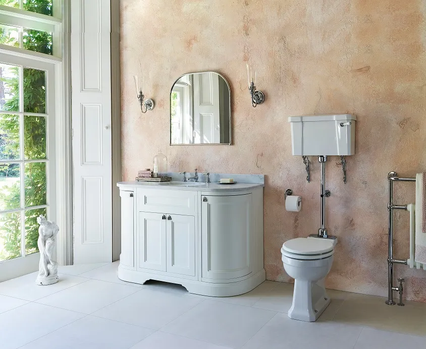 image of burlington riviera room shot with large vanity unit with worktop and basin, 3 tap hole chrome set, arched mirror and a low level toilet