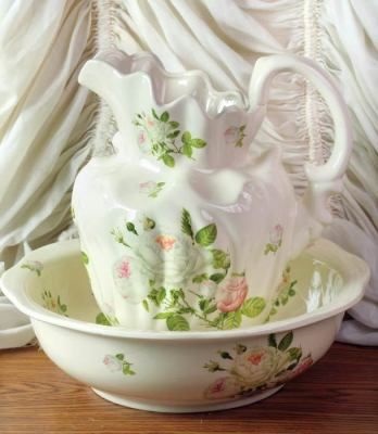Close up image of a floral pitcher and washbowl