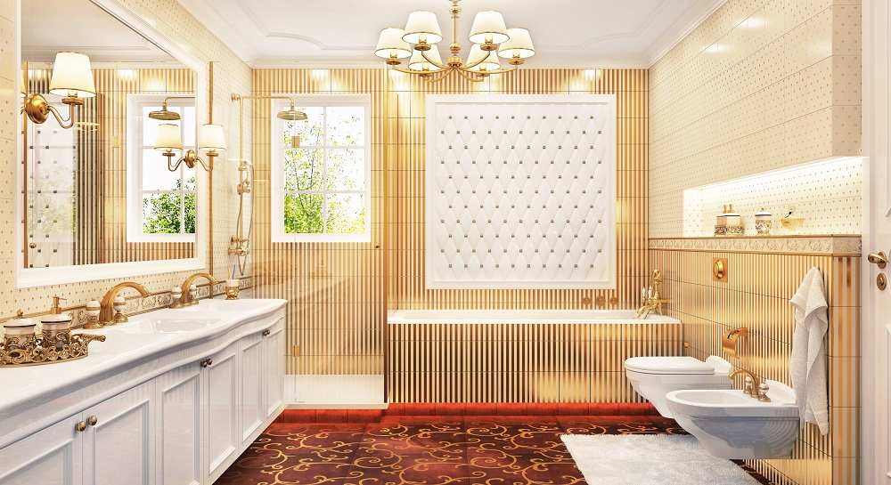Lifestyle image of a white and gold bathroom design, featuring striped white and gold tiles, white and gold spotted tiles, white double washbasin, gold taps and a gold exposed shower set