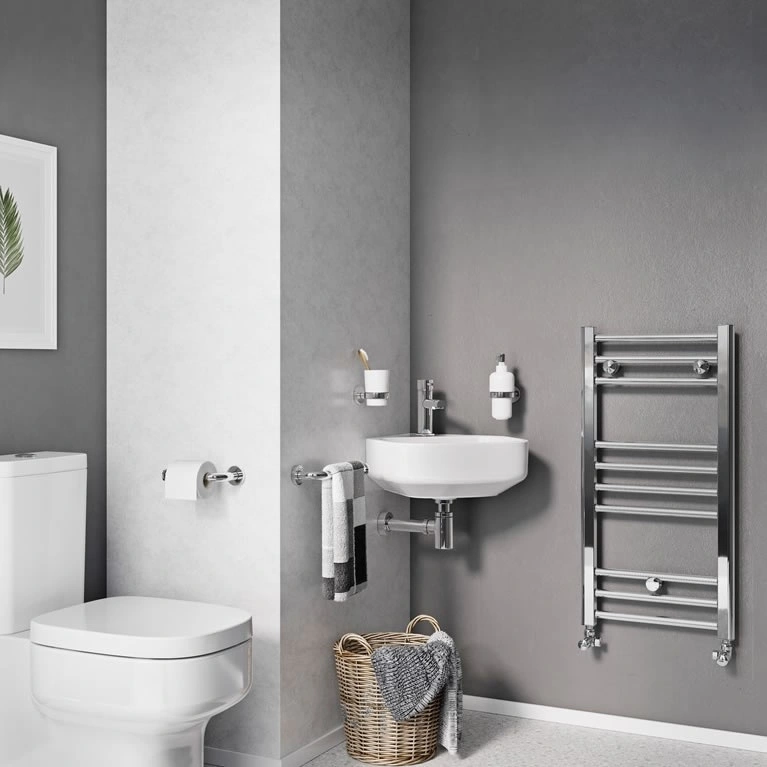 image of a corner basin in a grey bathroom space next to a chrome towel rail