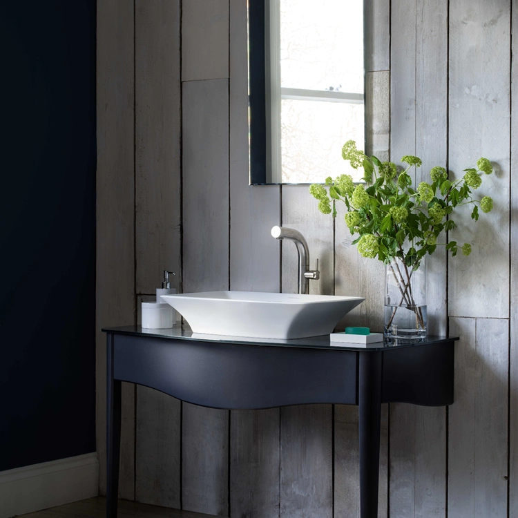 image of a countertop basin on a blue coloured console style table
