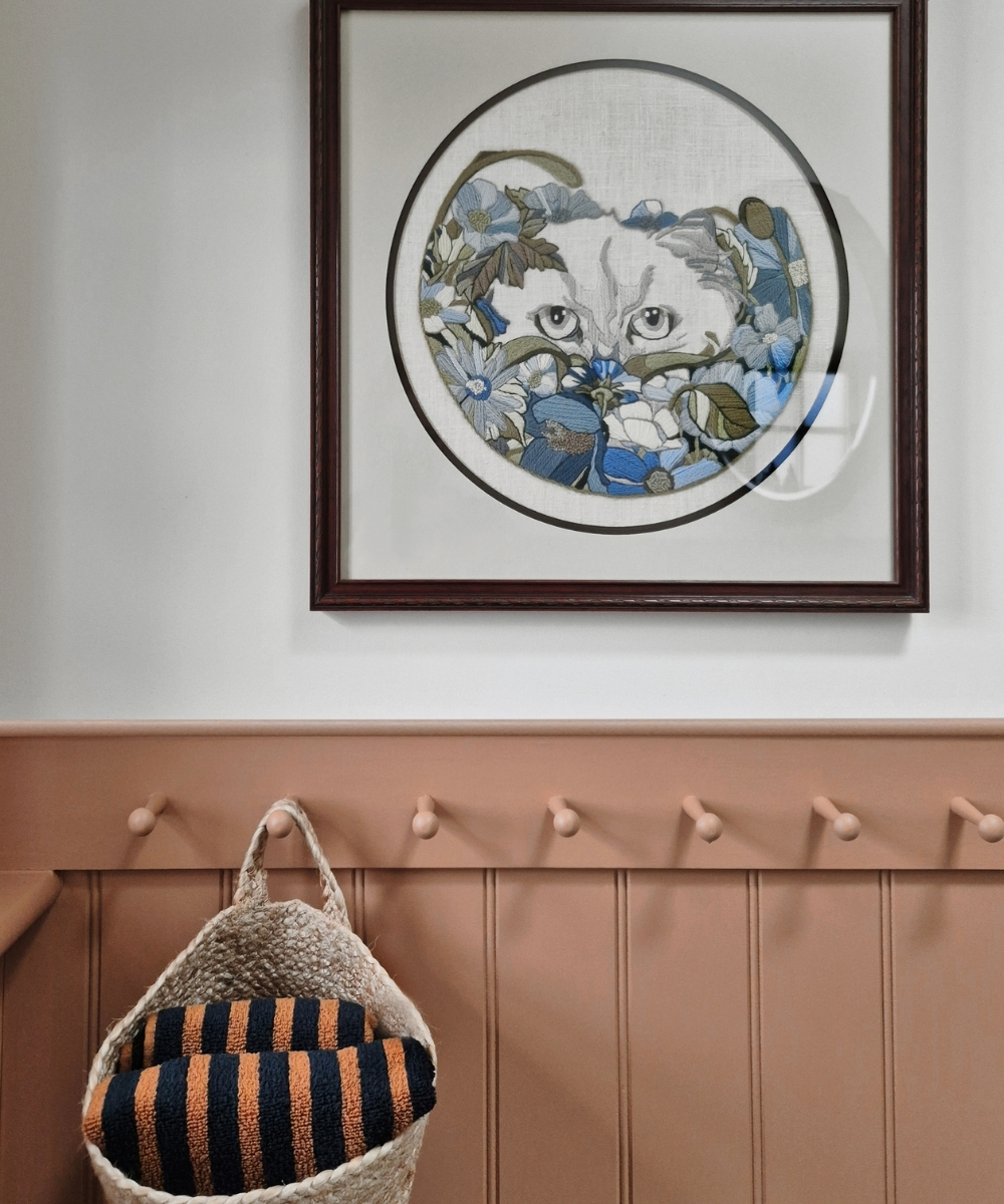 image of cat crewel embroidery framed in bathroom in refurbishment by restoring lansdowne