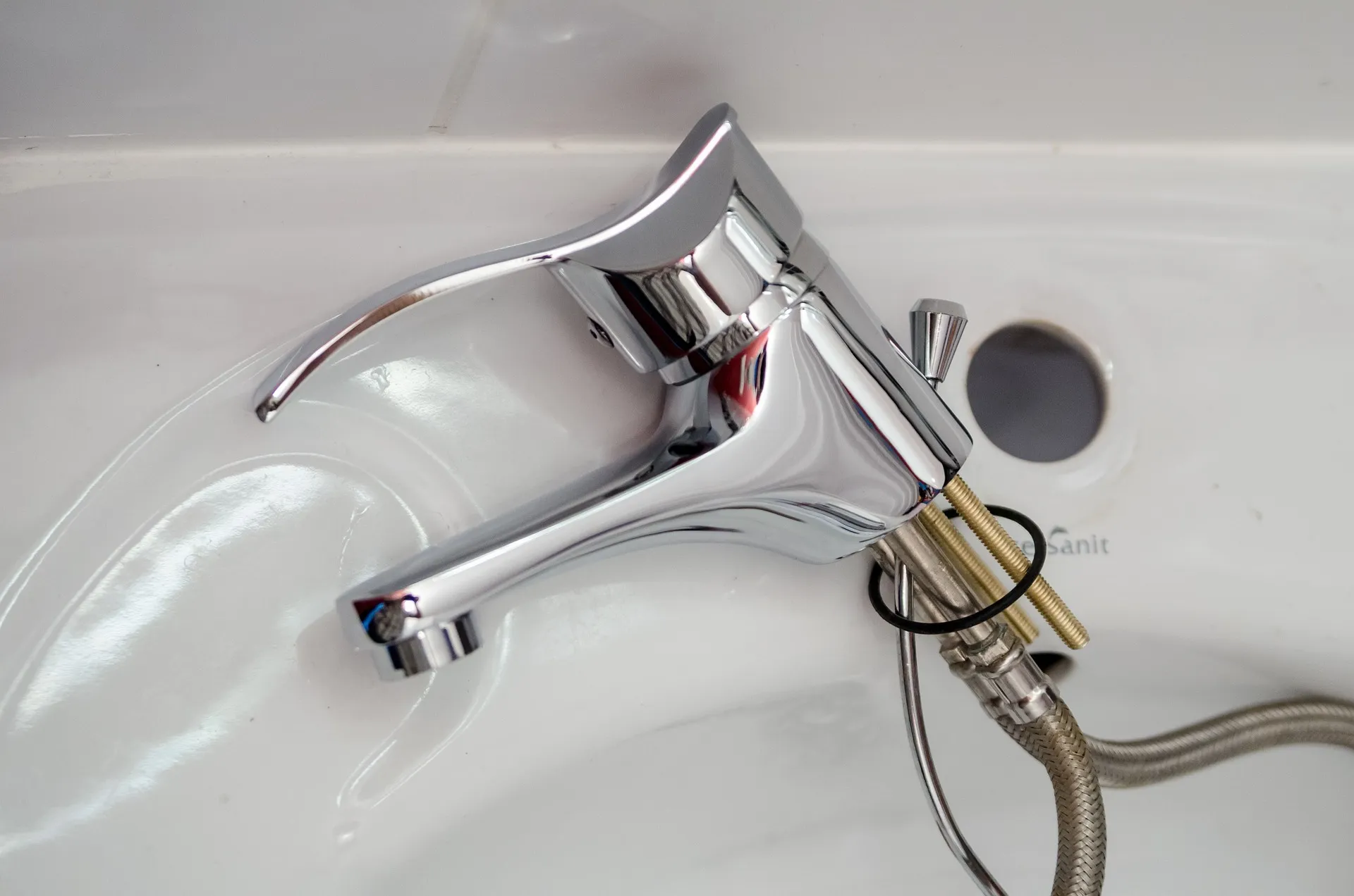 image of a disconnected tap from basin