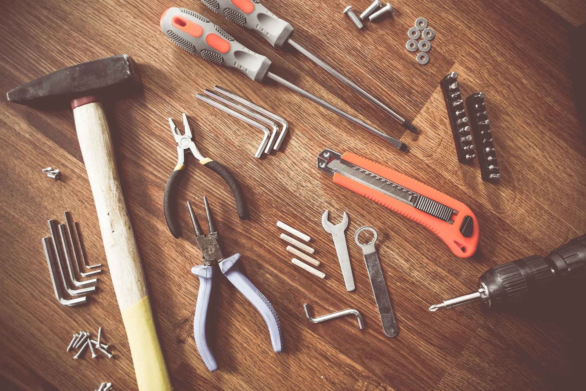 image of an assortment of tools from spanners, drills, knives, wire cutters, screwdrivers, hammers and washers