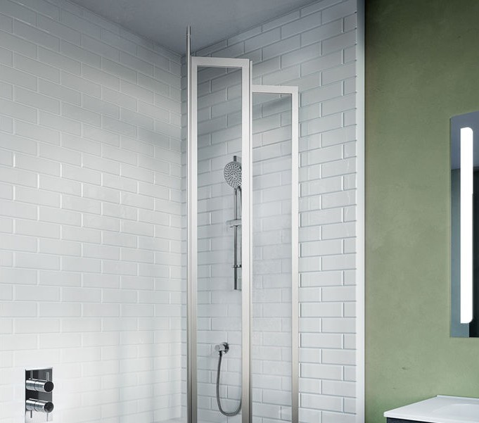 Product Lifestyle image of a Crosswater Kai 6 Fully Folding Bath Screen with its panels partially folded