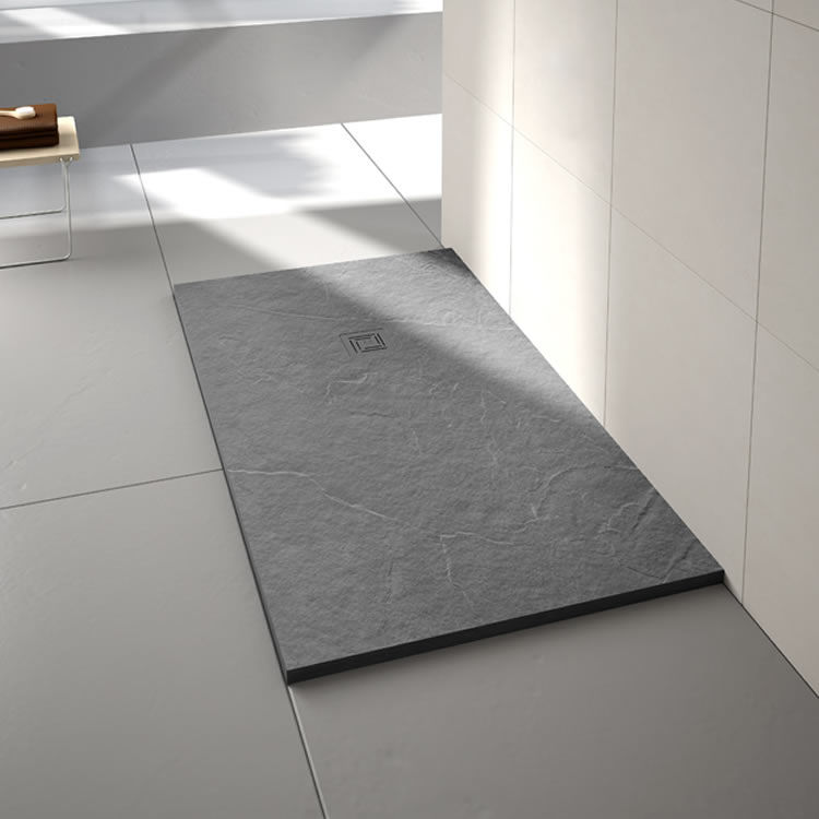 Lifestyle image of a rectangular stone resin walk in shower tray