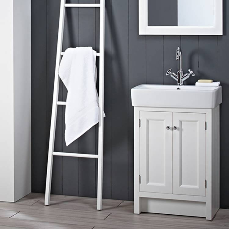 Lifestyle image of white floorstanding washbasin vanity unit with two doors
