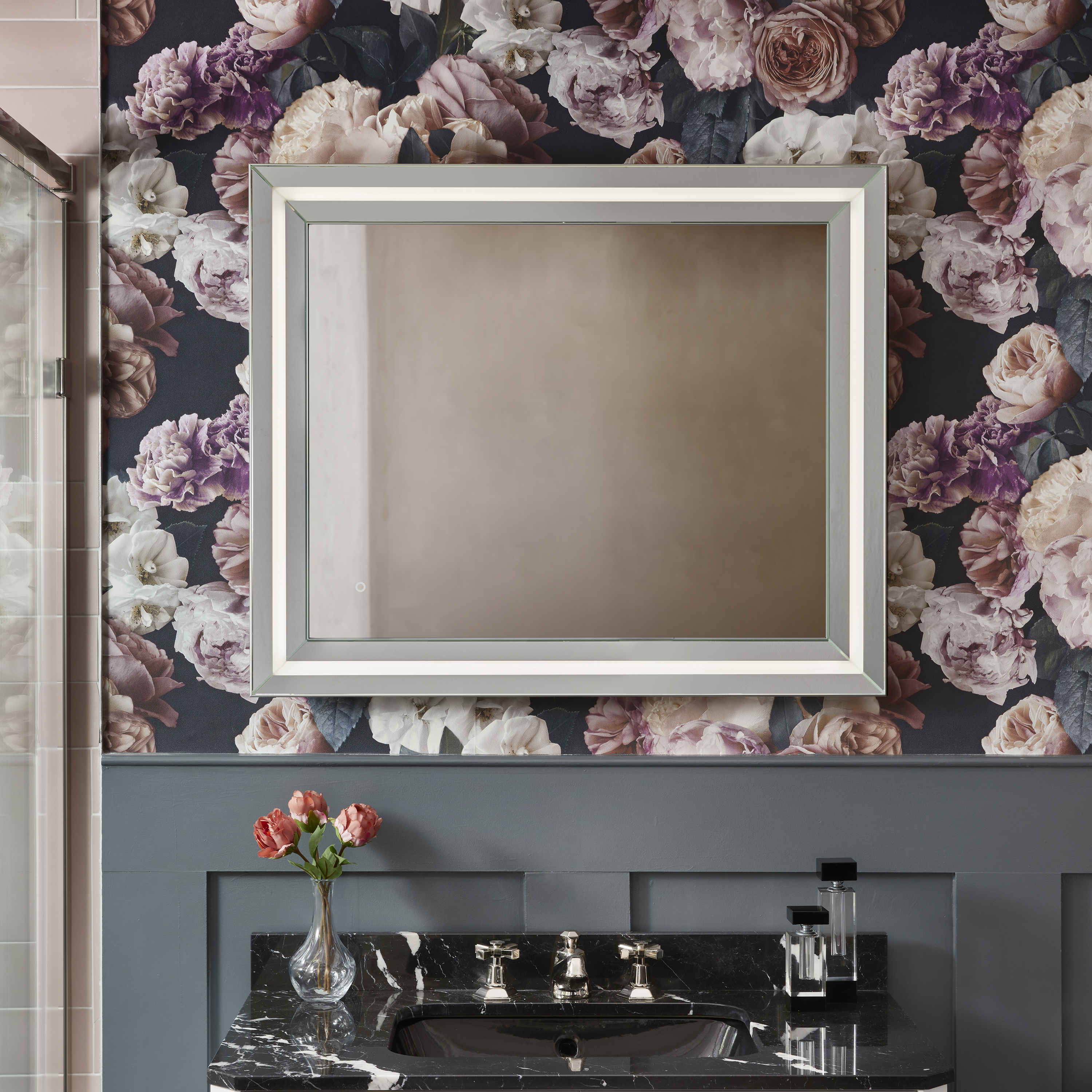 lifestyle image of origins living ravenna mirror on floral bathroom wall