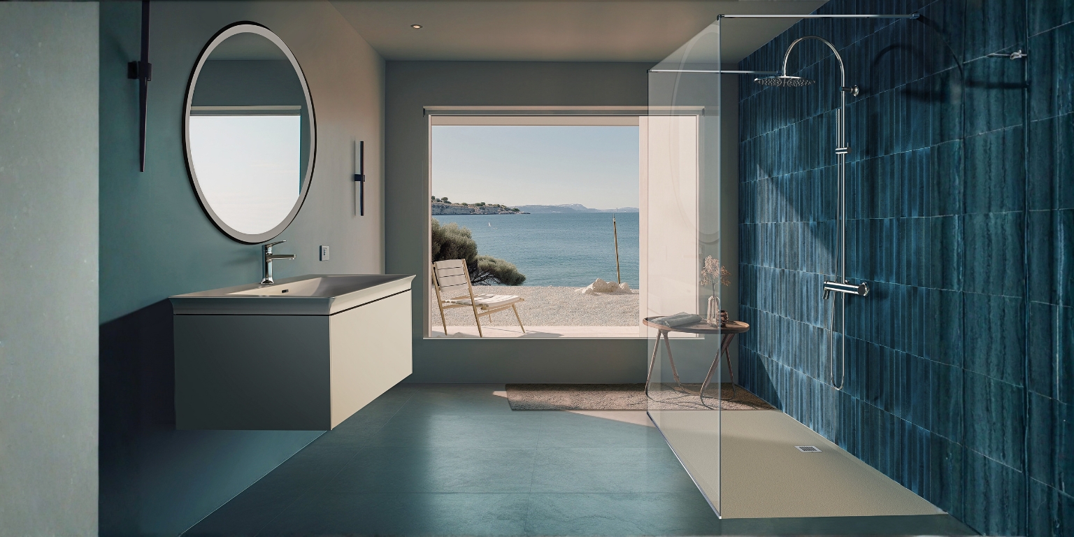 A coastal inspired bathroom with white walls and blue tiles