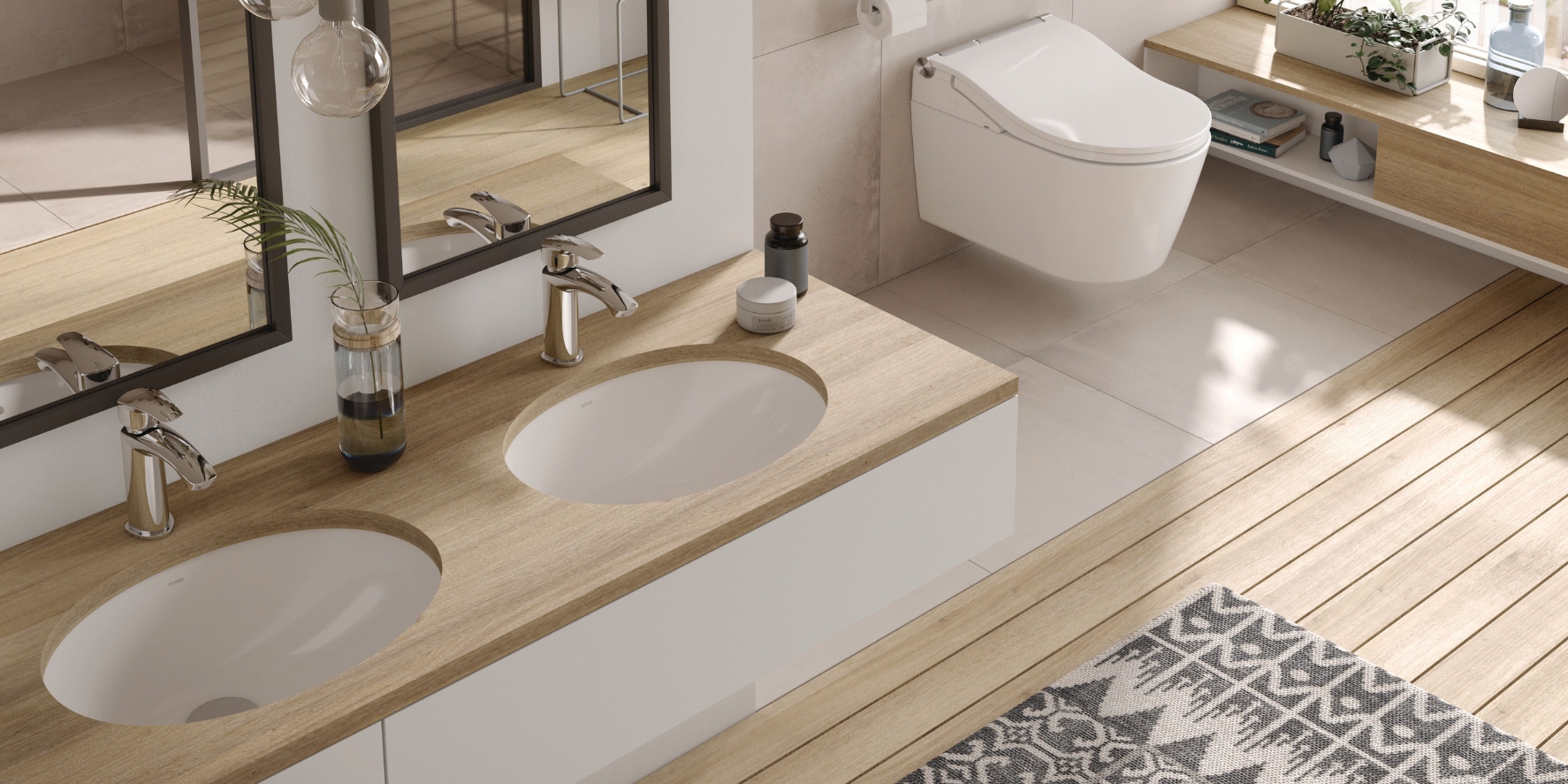 A bathroom with wooden flooring, inset basins and a TOTO Washlet