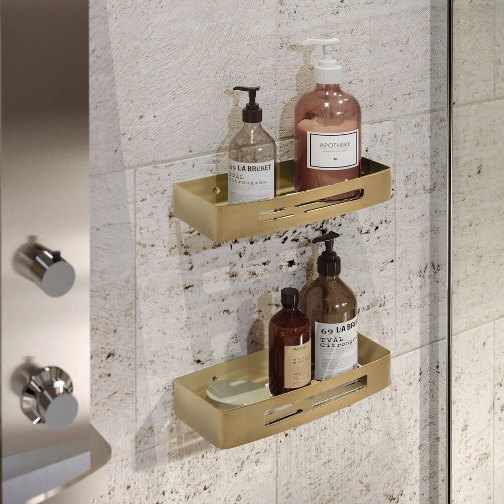 lifestyle image of the Origins Living Nerva Brushed Brass Shower Basket