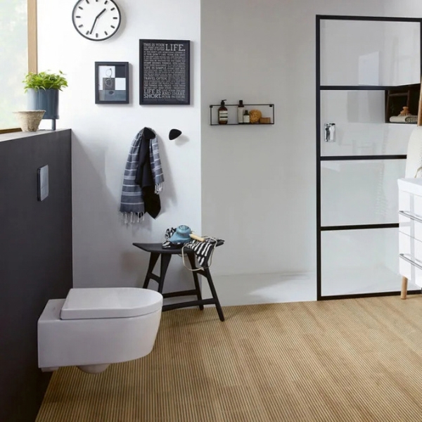 Lifestyle image of a wall-hung toilet fitted underneath a window
