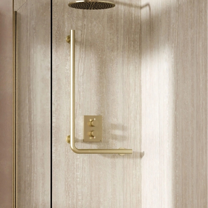 Lifestyle image of the Crosswater Brushed Brass Right-Angle Grab Bar