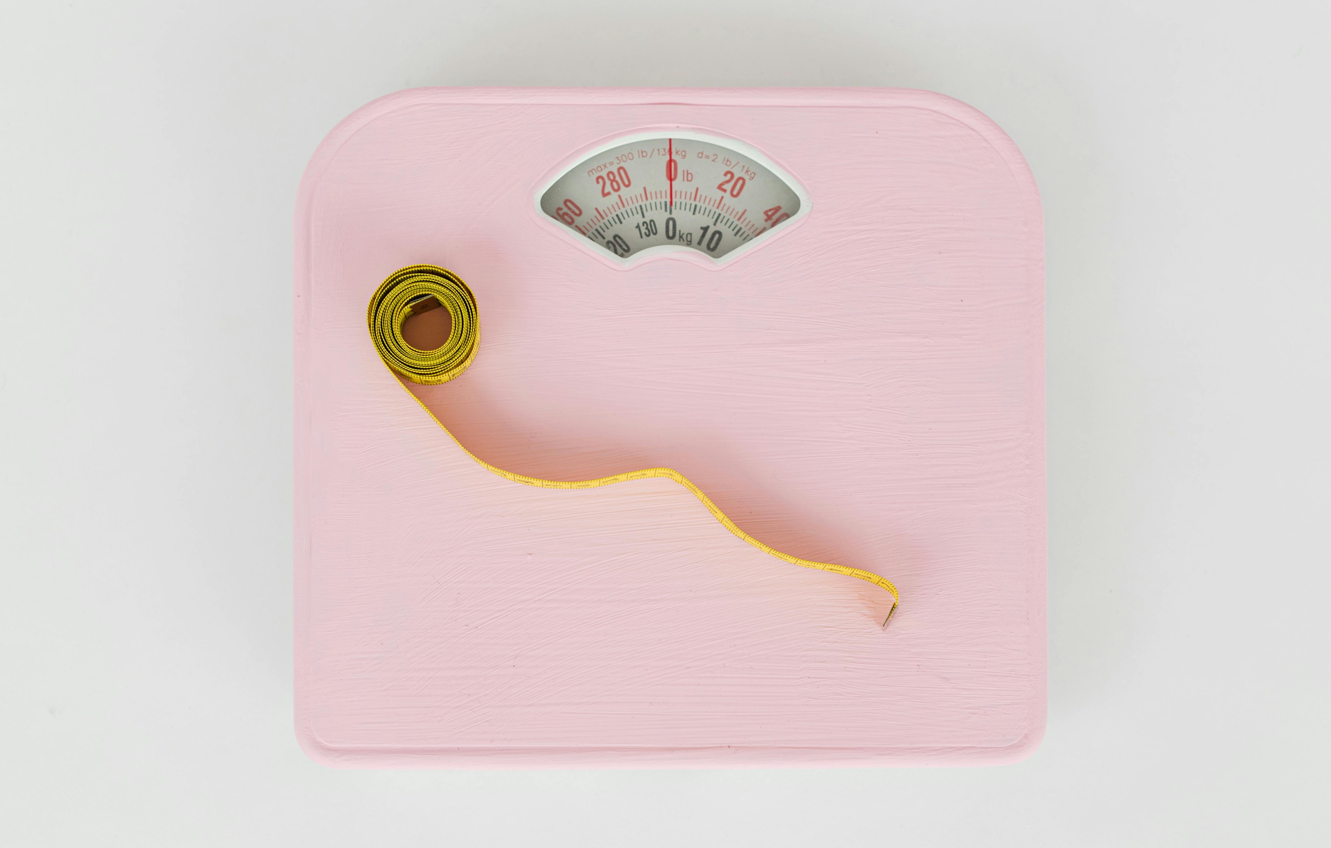 Image of weighing scales and a tape measure