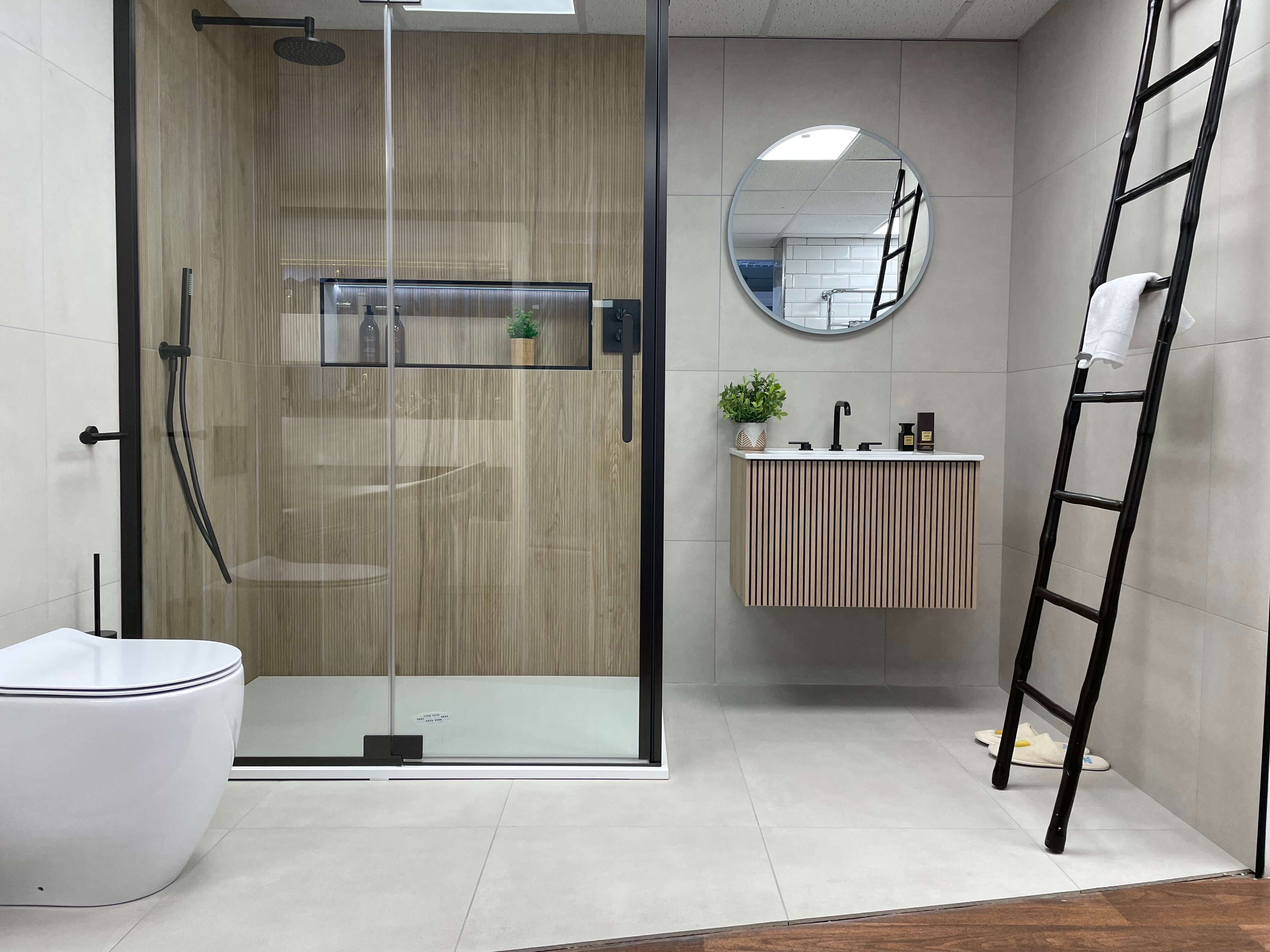 image of shower enclosure with wooden wall panels and matching wooden fluted vanity unit