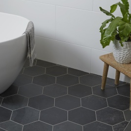image of slate bathroom floor tiles in hexagonal pattern - ca pietra metropolitan slate riven finish tiles in bathroom
