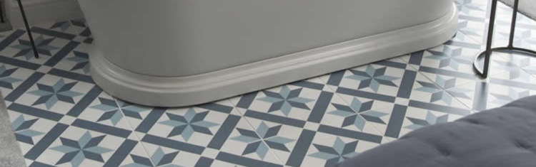 Close up product lifestyle image of the tiled flooring underneath the BC Designs 1800mm Acrylic Freestanding Boat Bath