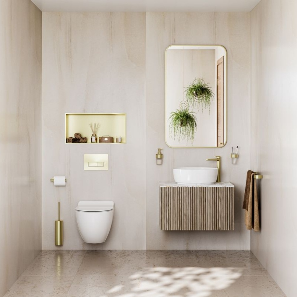 Lifestyle image of the Showerwall Laminate Indiana Limestone 2440mm x 1179mm Proclick Hydrocore Wall Panel - SW94 with toilet, basin and vanity unit with traditional fixtures