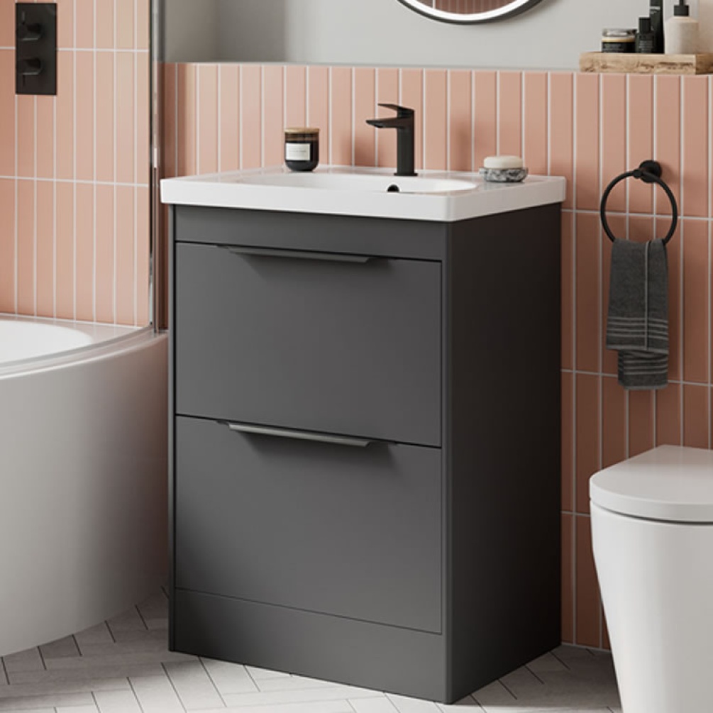 Photo of the Shoreditch Floorstanding Double Drawer Unit in Matt Grey with matt black handles and pink tiled wall