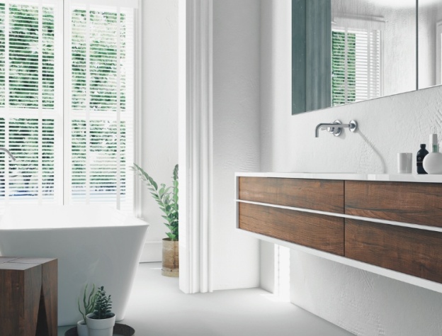 Lifestyle image of a brown and white bathroom design, featuring a wall mounted wooden washbasin unit