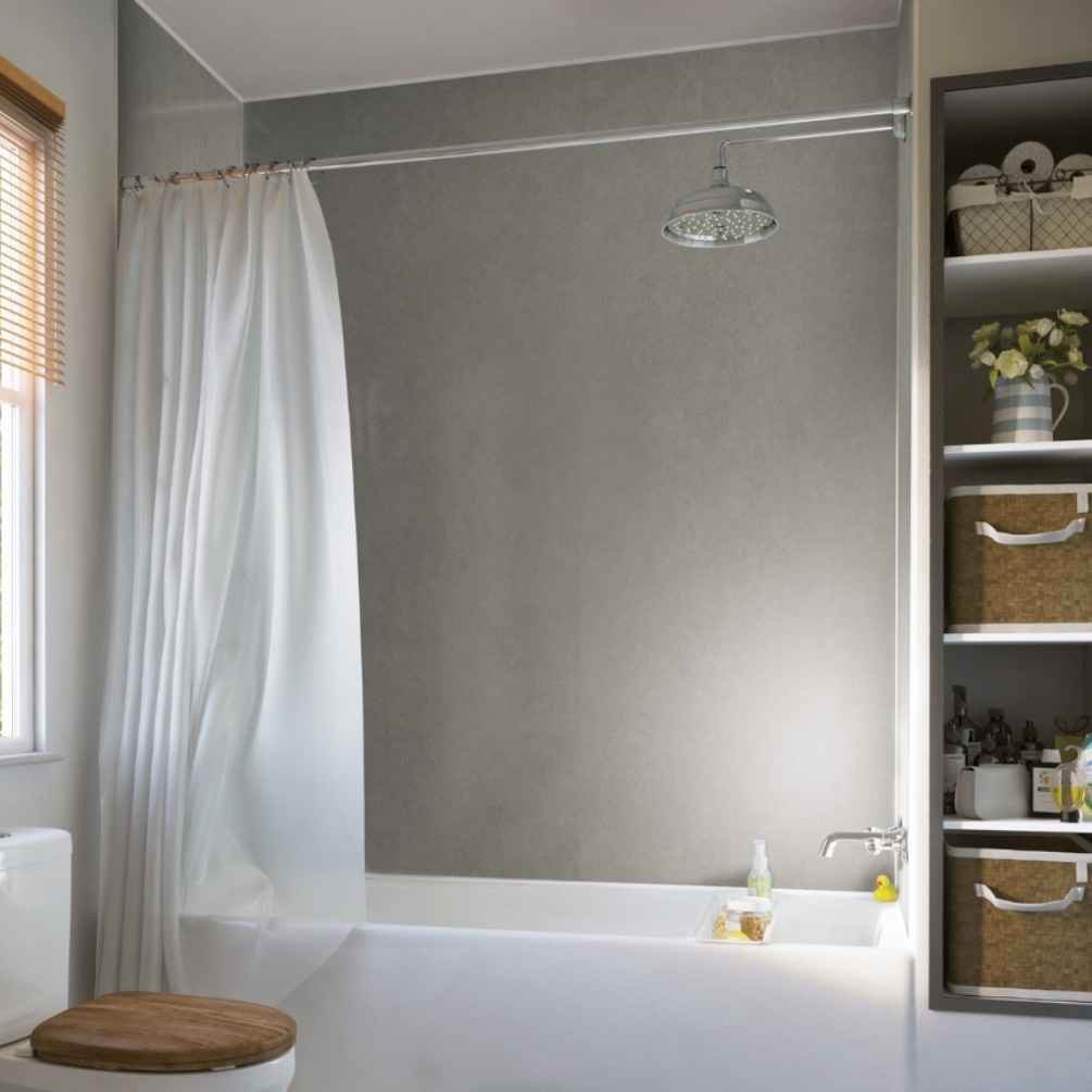 Lifestyle image of the Showerwall Laminate Pearl Grey 2440mm x 900mm Square Cut Ply Wall Panel - SW29 installed against a single ended bath tub