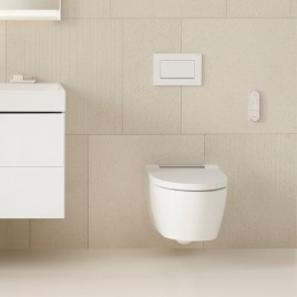 Product lifestyle image of a Geberit wall hung toilet in a beige tiled bathroom