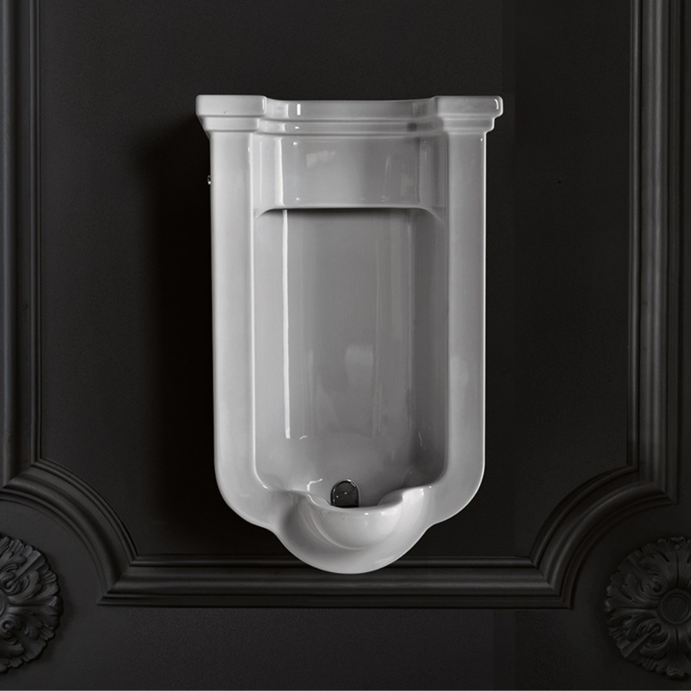 Lifestyle image of the Crosswater Waldorf Urinal installed on a black traditional wall
