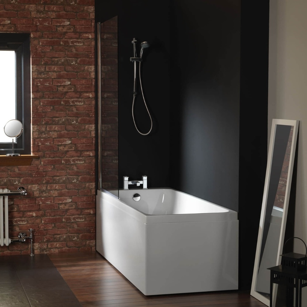 Lifestyle image of the Carron Profile SE 1600mm x 700mm Single Ended Bath installed in the corner of a bathroom with a mounted shower