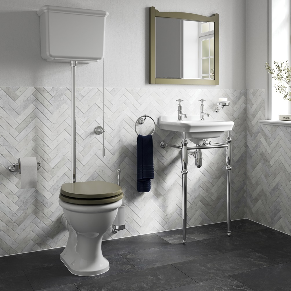 Product Lifestyle Image of Burlington Guild High Level Toilet in white herringbone tiled bathroom with green seat GU6118CW GU7002CW
