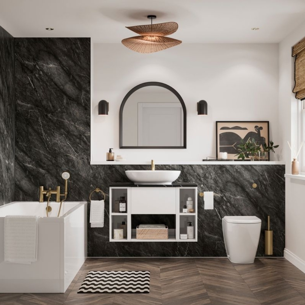 Lifestyle image of the Showerwall Laminate Nero Marble 2440mm x 879mm Proclick Ply Wall Panel - SW85 installed across a bathroom with straight-edged bath, wall-hung vanity unit with basin and back to wall toilet