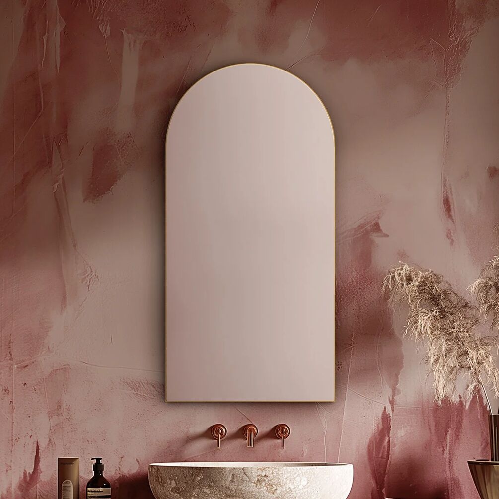 Lifestyle image of Origins Living Oslo Arched Brushed Brass 500 x 1000mm Mirror