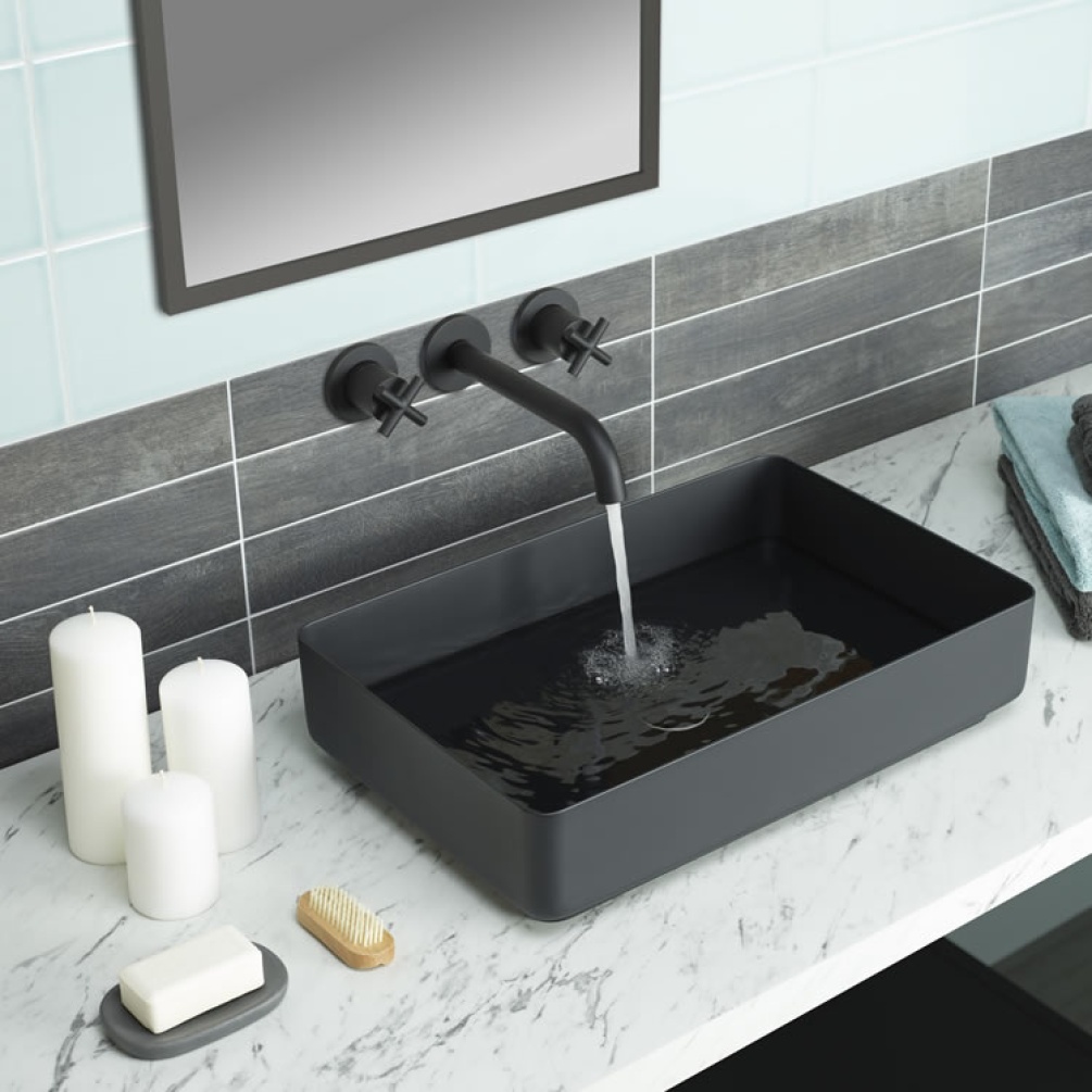 Close up product lifestyle image of the JTP Vos Matt Black Stainless Steel Countertop Basin