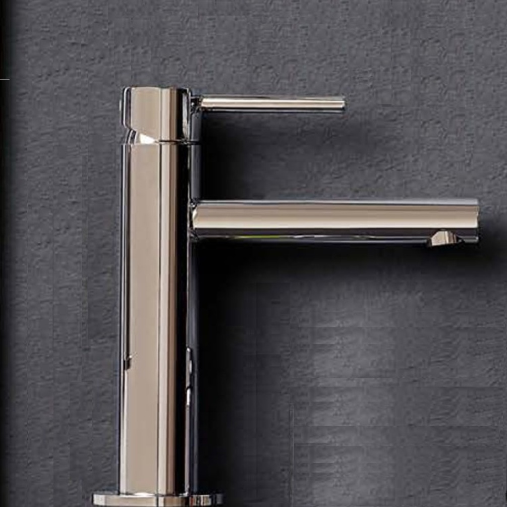 Product Lifestyle Image of VitrA Origin Chrome Mono Basin Mixer against grey bathroom wall A42556