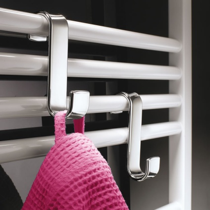 Lifestyle image of Origins Living Gedy Radiator Hook chrome on white towel rail.