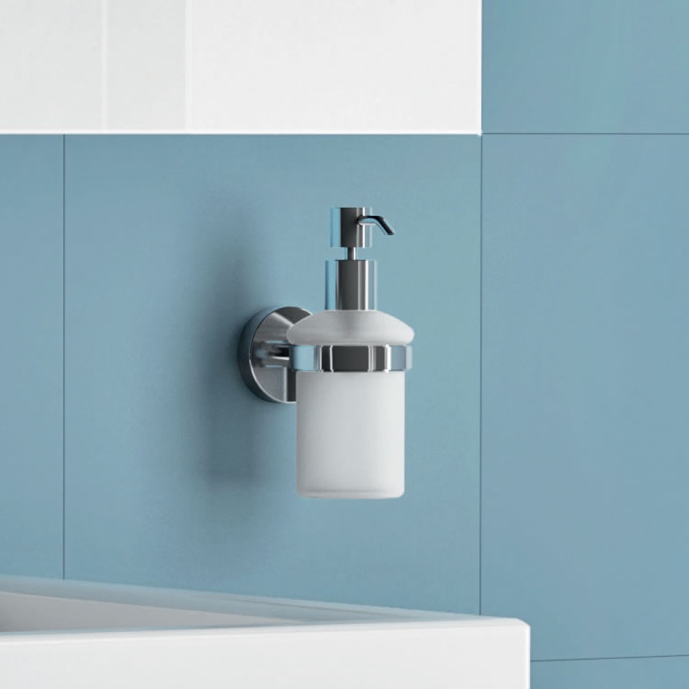 Lifestyle image of Origins Living Gedy G Pro Soap Dispenser Chrome mounted on blue tiles.