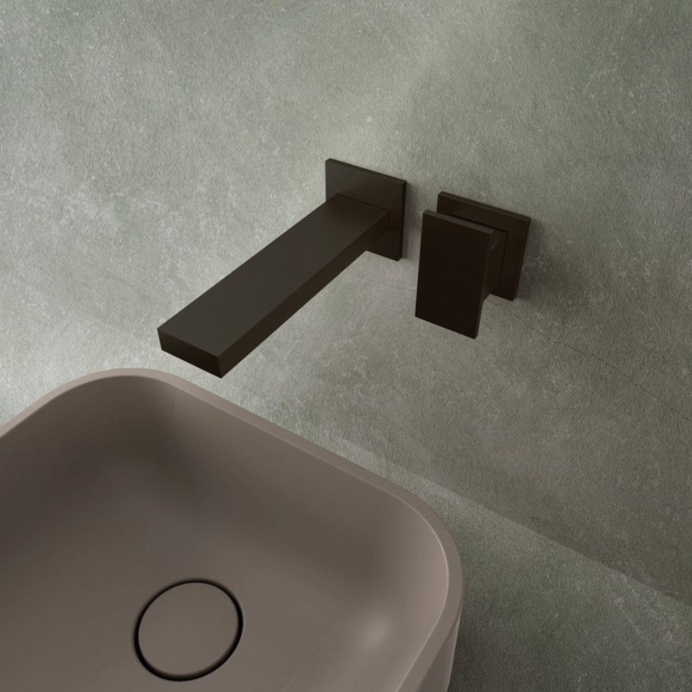 Lifestyle image of the Crosswater Myron Matt Black Wall Mounted Basin Mixer installed above a countertop basin