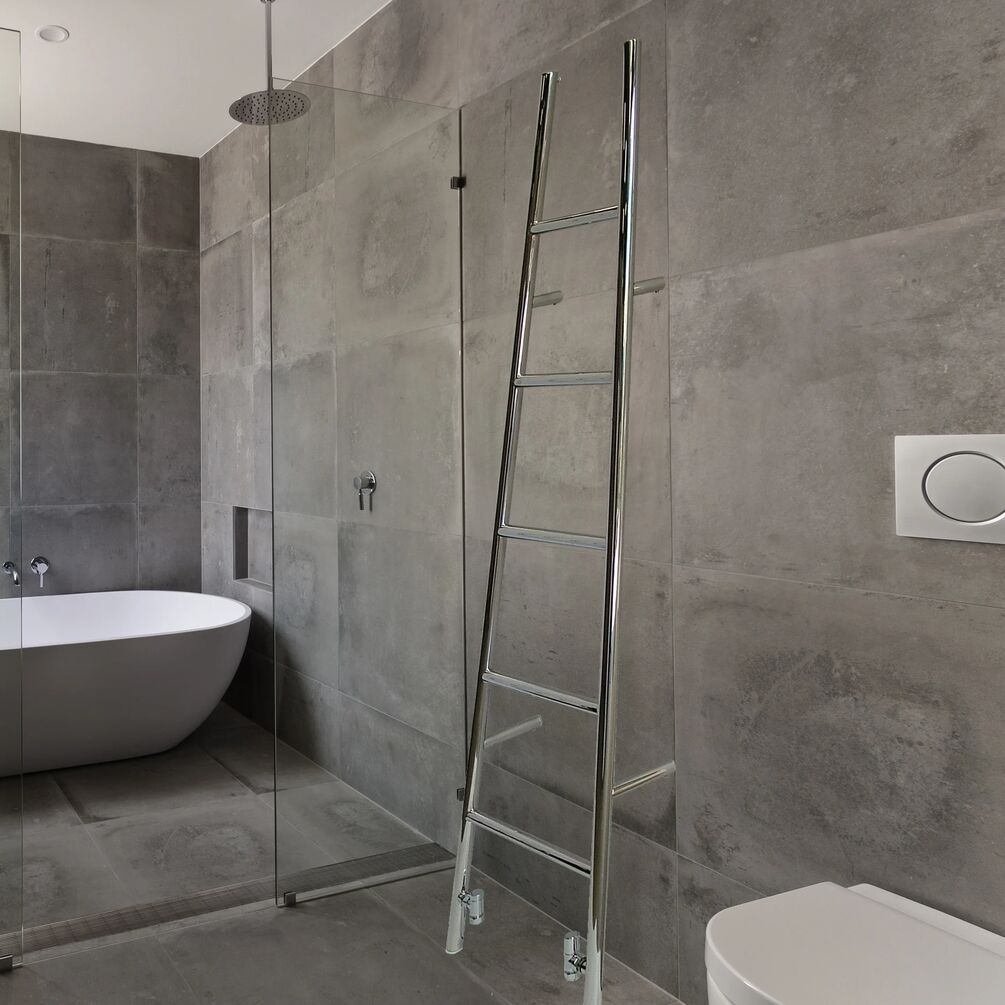 Lifestyle image of the The Sussex Range by JIS Rye 1800mm x 520mm Polished Stainless Steel Heated Leaning Towel Rail