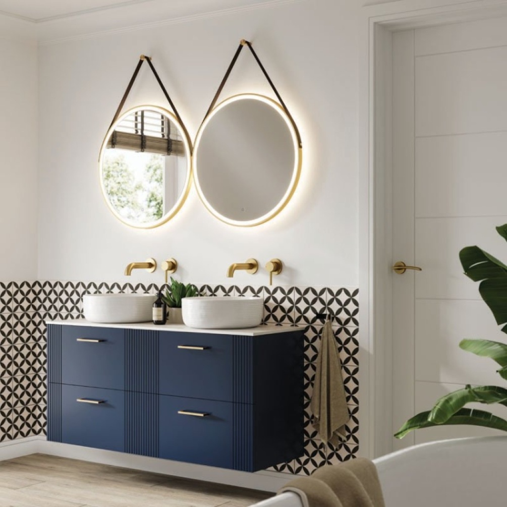 Product Lifestyle image of two HIB Solstice Brushed Brass 600mm Circular LED Mirrors with Straps